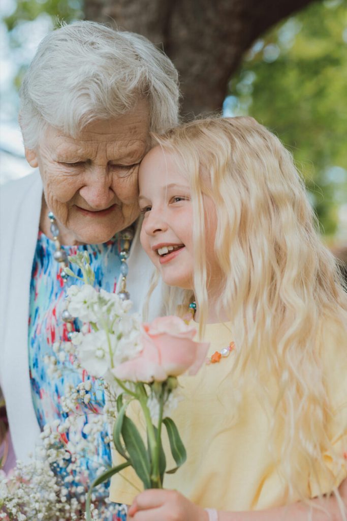 A resident visiting with her granddaughter