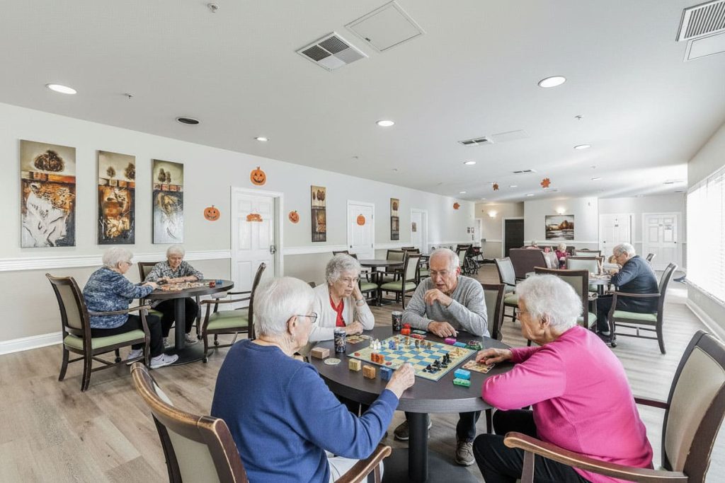 A resident and a caregiver together at Helping Hands Senior Care